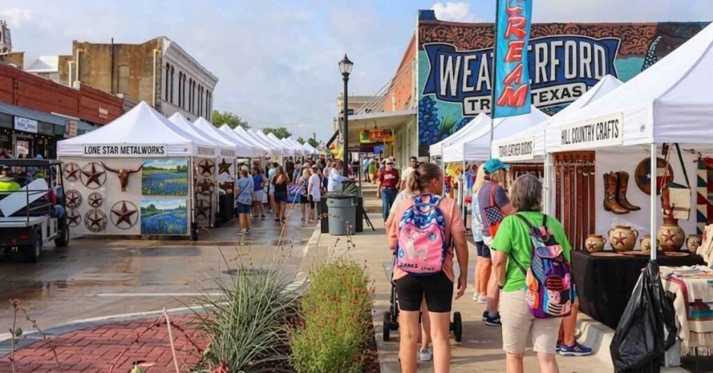 Crowds shopping at the arts and crafts vendor booths during the Parker County Peach Festival